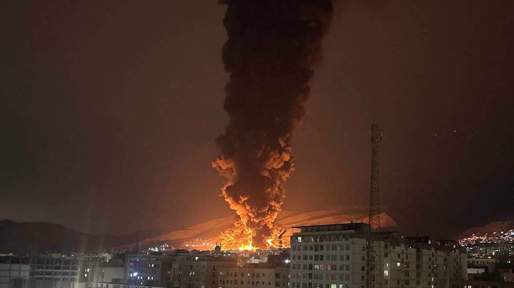 Smoke rises following an Israeli attack on the Sharan Oil depot in Tehran, Iran, on March 8, 2026. (Photo via social media)